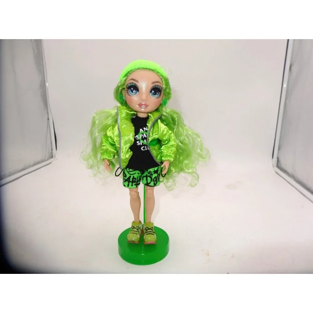 Rainbow High Jade Hunter Fashion Doll Dressed in Shorts Hat Jacket Top and Stand